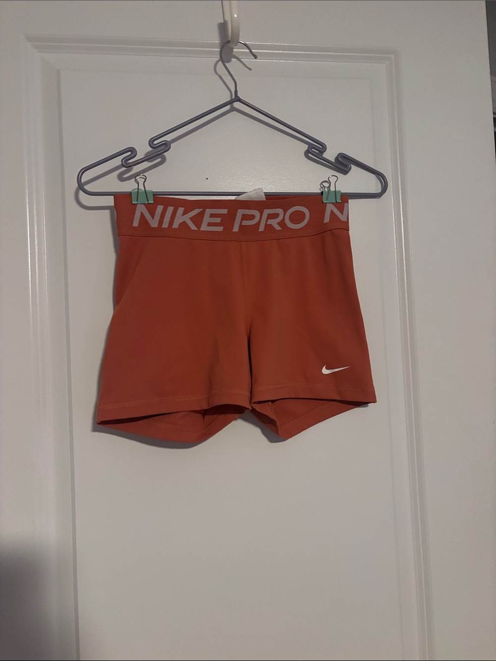 Nike Women’s Pro Shorts in Coral with White Logo